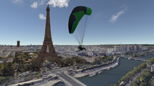 Paraglider next to the Eiffel Tower
